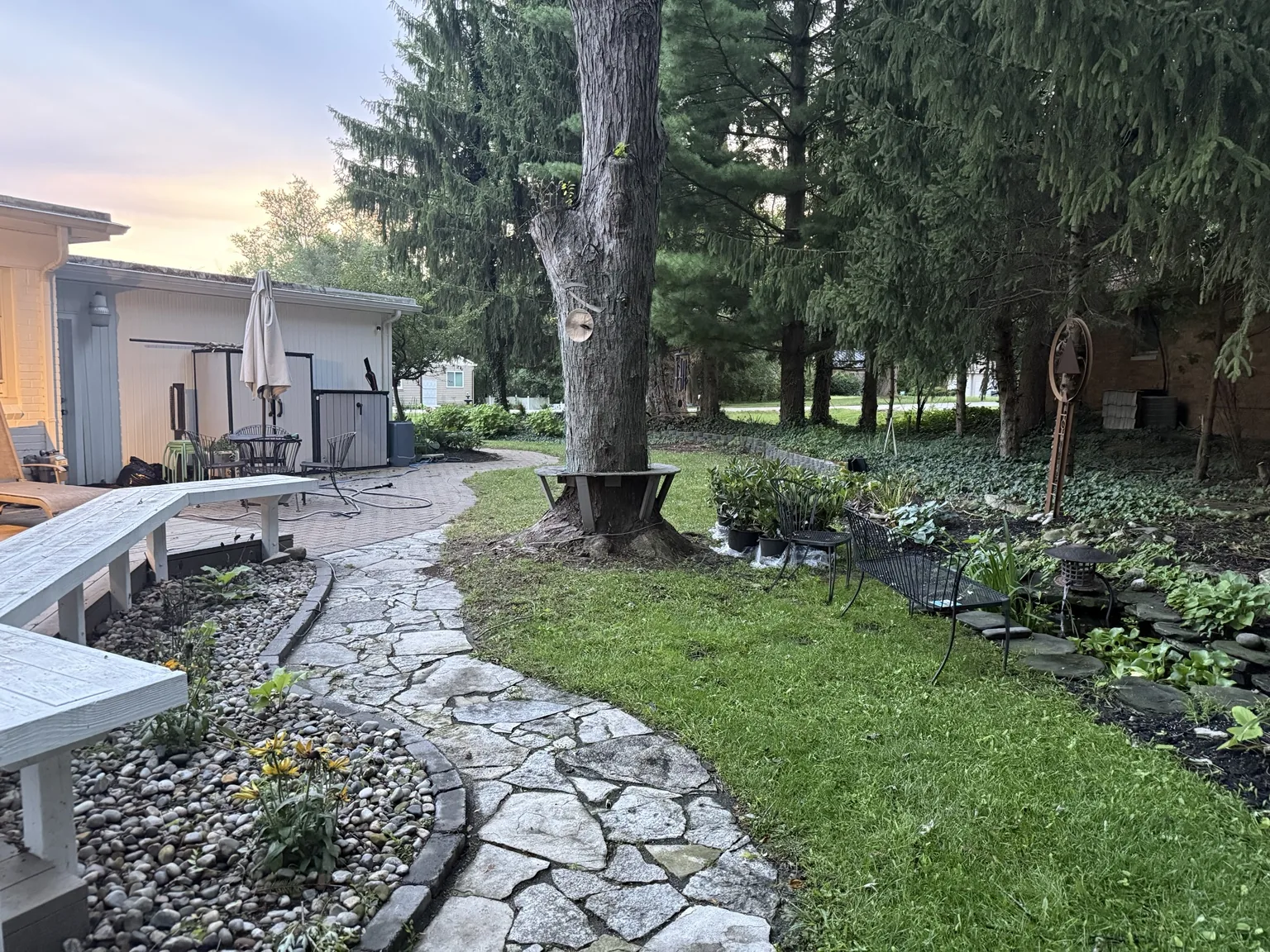 Stone path and landscaped backyard